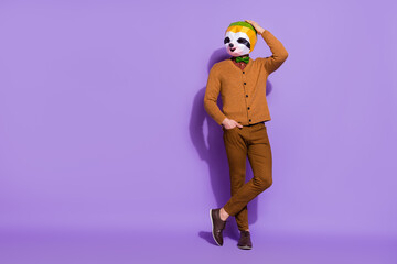 Full length portrait of cool confident red panda head person hand on head isolated on violet color...