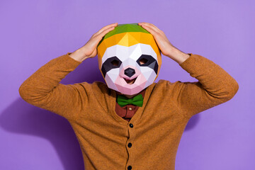 Photo of young man hands touch head impressed information news red panda isolated over purple color...