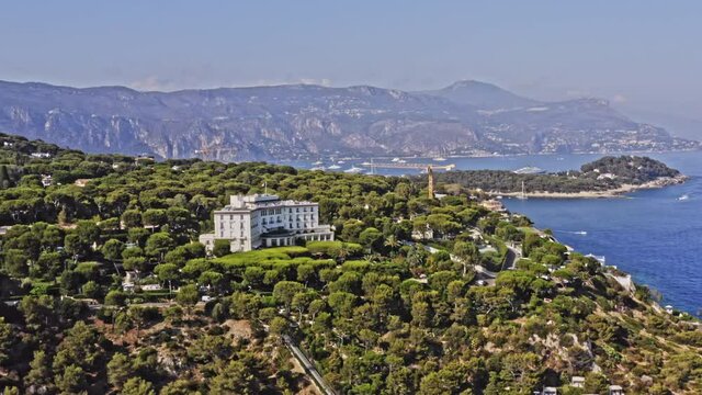 Saint Jean Cap Ferrat France Aerial v6 establishing pull out shot away from luxurious four seasons grand-hotel du cap-ferrat, overlooking at the whole peninsula - July 2021