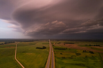 Aerial summer evening stormy view of highway road, before the storm