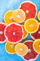 slices of citrus. Fresh fruits sliced ​​in half orange, pink grapefruit,  lemon