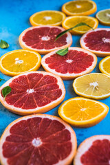 slices of citrus. Fresh fruits sliced ​​in half orange, pink grapefruit,  lemon