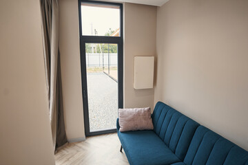 Focused photo on glass door being in small room