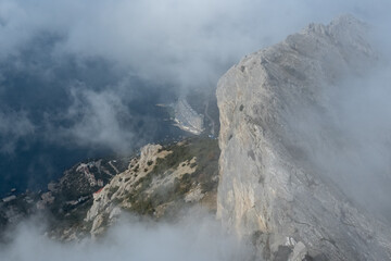View from Mount Ilyas-kaya on the southern coast of Crimea in fog