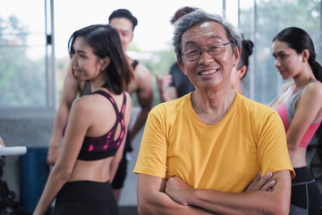 Senior man and young group people, Friends different ages in gym working out