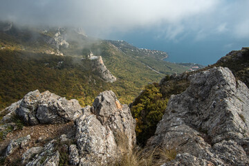 View from the mountain to Foros village and a beautiful church on the edge of the cliff