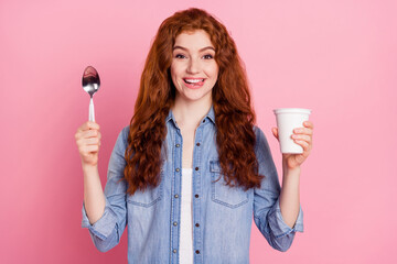 Photo of pretty hungry young woman wear denim shirt showing tongue ready to eat ready quick soup isolated pink color background - obrazy, fototapety, plakaty