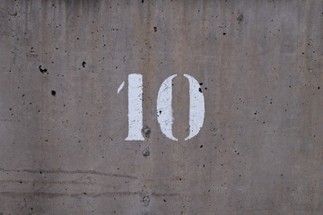 10, round number printed in white on one wall