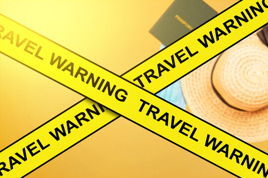 Passport, Hat, And Face Mask Covered With Travel Warning Tape Due New Variant Of Covid 19 Omicron