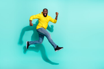 Fototapeta na wymiar Full length profile side photo of guy jump run sporty shopping marathon isolated over cyan color background