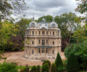 View of the Chateau de Monte Cristo on an autumn cloudy day from the hillside in Port Marly.