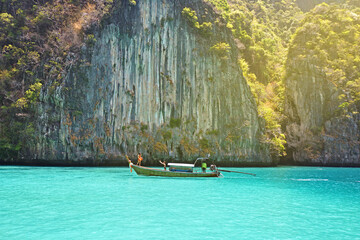 Traveler in summer relaxing on wooden boat ,vacation at Krabi  Thailand