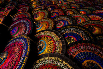 Myanmar's ancient umbrella It's a colorful umbrella. strung with colorful threads of Mandalay, Myanmar