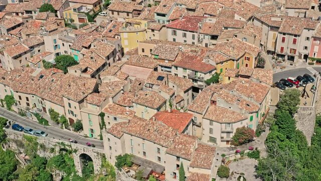 Moustiers Sainte Marie France Aerial v6 birdseye view drone flyover old medieval village town and spectacular natural landscape of ravine and mountain cliff - July 2021