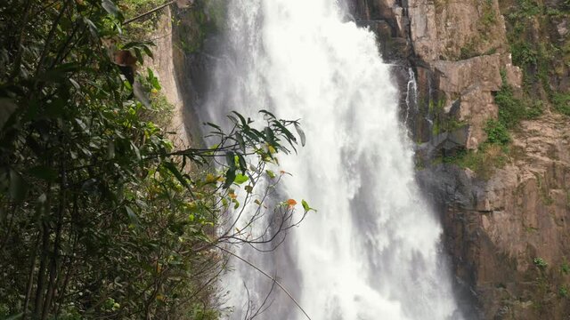 Close up of waterfall in green wild tropical forest in National Park. Tropical mountain landscape of water waterfalls river flow. UNESCO natural world heritage. Haew Narok waterfall in Thailand