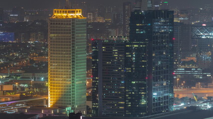 Fototapeta na wymiar Aerial view of skyscrapers with World Trade center in Dubai night timelapse.