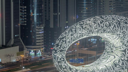 Dubai museum of future exterior design aerial night timelapse. - obrazy, fototapety, plakaty
