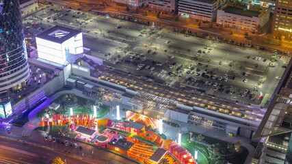 Fototapeta na wymiar Gate Avenue new promenade aerial night timelapse, located in Dubai international financial center.