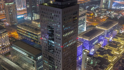 Office tower located in the Dubai International Financial Centre night timelapse