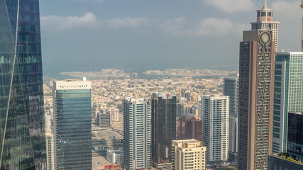Obraz premium Skyscrapers on Sheikh Zayed Road and DIFC timelapse in Dubai, UAE.