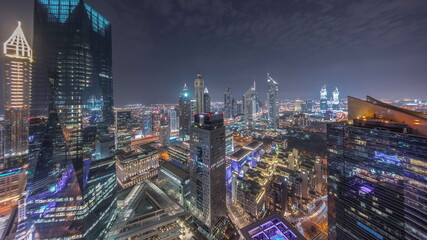 Obraz premium Panorama of futuristic skyscrapers in financial district business center in Dubai night timelapse
