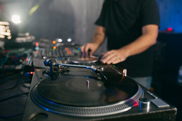 View of a deejay using vinyl turntables during a musi set