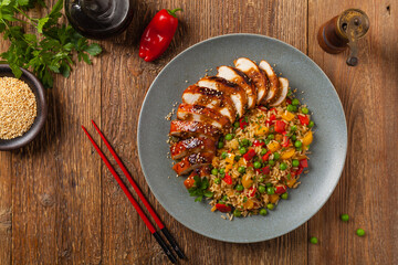Grilled chicken breast in teriyaki sauce. Served with brown rice and vegetables.
