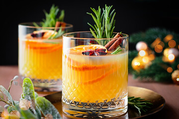 Winter warming bourbon old fashioned cocktail with oranges, cinnamon and rosemary
