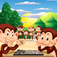 Two monkeys playing chess together