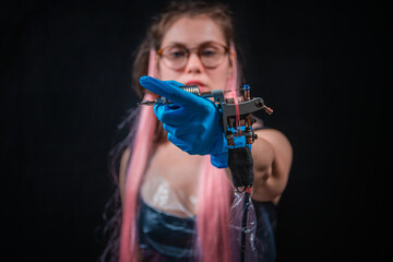 Professional tattoo artist looking at the camera in studio