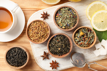 Concept of cooking tea with different types of tea on wooden background