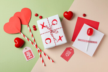 Valentine's Day accessories on two tone background, top view