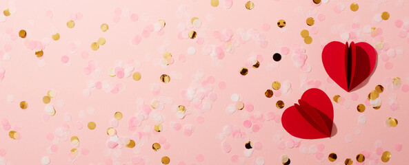 Red paper shape hearts and confetti valentine and mothers day concept