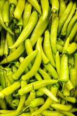 green peppers on the market background
