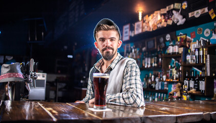 Expert barman makes a cocktail