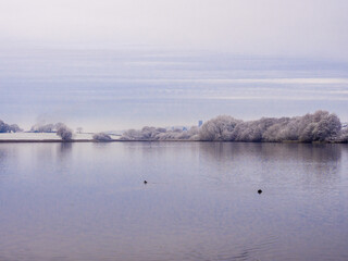 First wonters snow at Pickmere Lake, Pickmere, Knutsford, Cheshire, UK