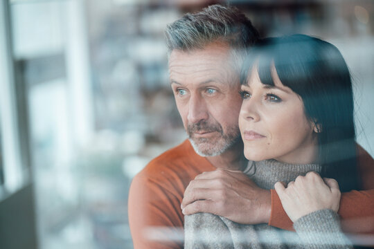 Thoughtful couple looking away at cafe - Powered by Adobe