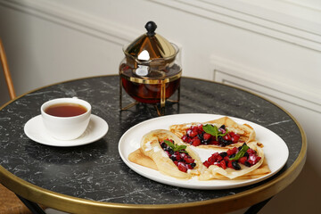 Crepes served with fresh berries and apples