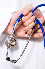 close up of a doctor stethoscope and hands