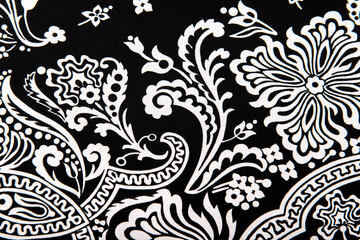 Seamless vintage abstract white floral pattern on black textiles fabric, retro background