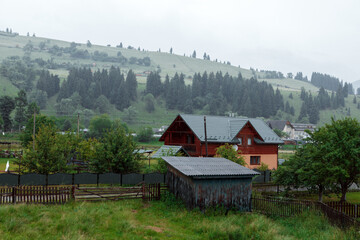 house on a steep mountain slope in the carpathians among the green forest