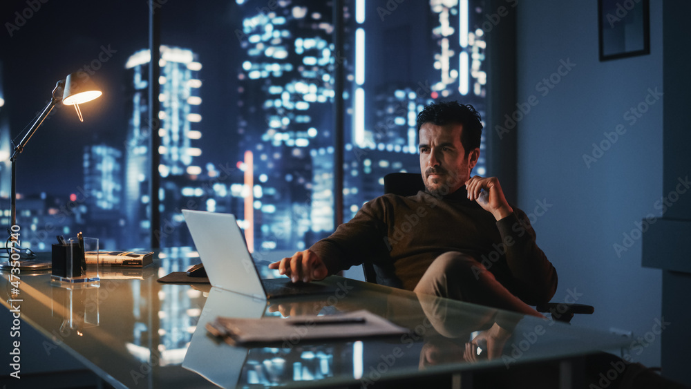 Aufkleber portrait of thoughtful successful businessman working on laptop computer in his big city office at n