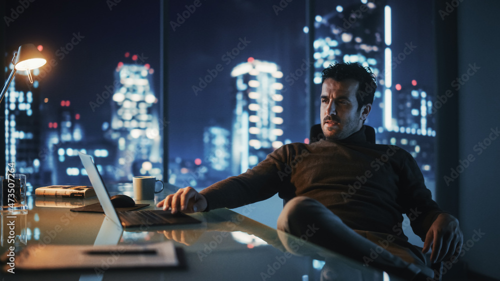 Aufkleber portrait of thoughtful successful businessman working on laptop computer in his big city office at n