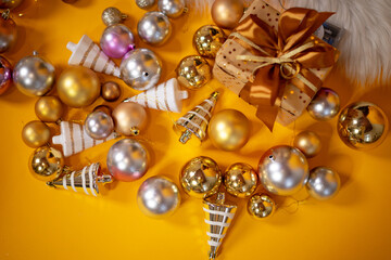 Gold, red and silver glitter Christmas balls pattern. Flat lay, top view, copy space. Christmas golden, red and silver balls decorations on white background. New year creative arrangement frame.