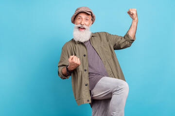 Photo of celebrate grey beard elder man hands fists yell wear peaky blinder khaki shirt isolated on blue color background