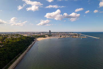 Gdynia city by the sea on a sunny day from a drone. Summer colors and sun rays in Gdynia.