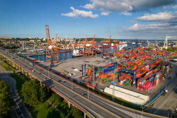 Port of Gdynia. Seaport, containers, container ships and sea transport from the bird's eye view on...
