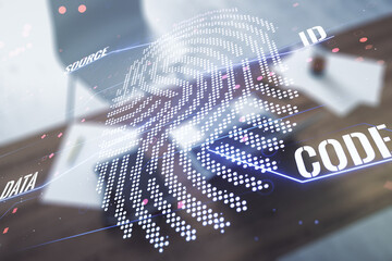 Double exposure of abstract creative fingerprint hologram and modern desktop with laptop on background, research and development concept