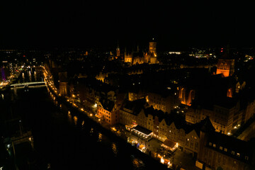 Fototapeta premium Gdańsk at night. Beautiful city on the Baltic Sea at night from drone flight.