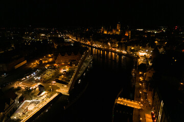 Fototapeta na wymiar Gdańsk at night. Beautiful city on the Baltic Sea at night from drone flight.